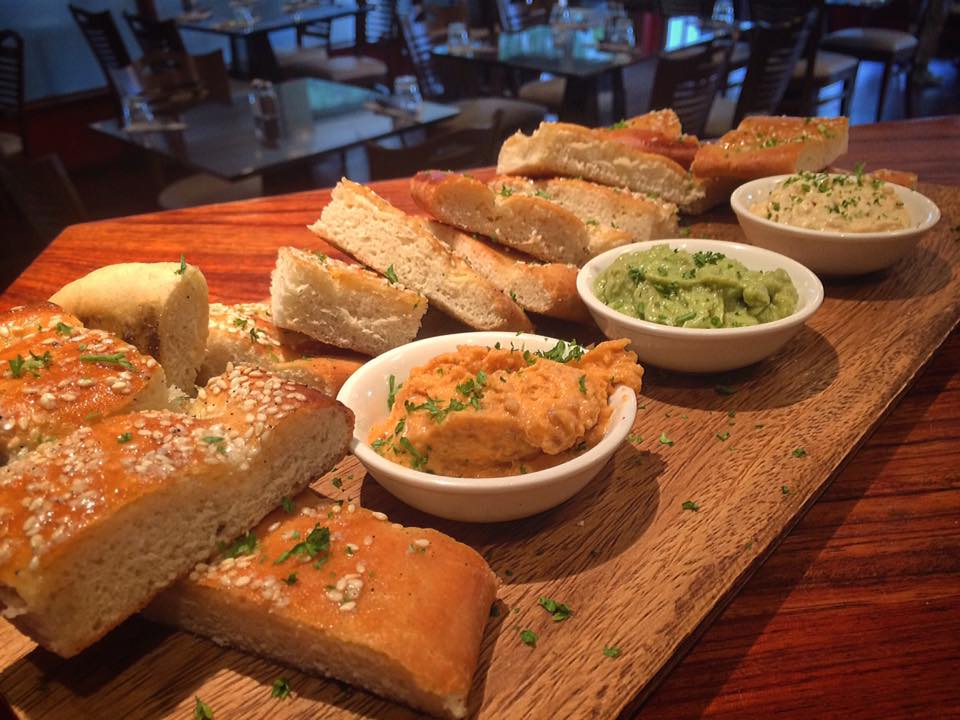 acacia wood platter with condiments